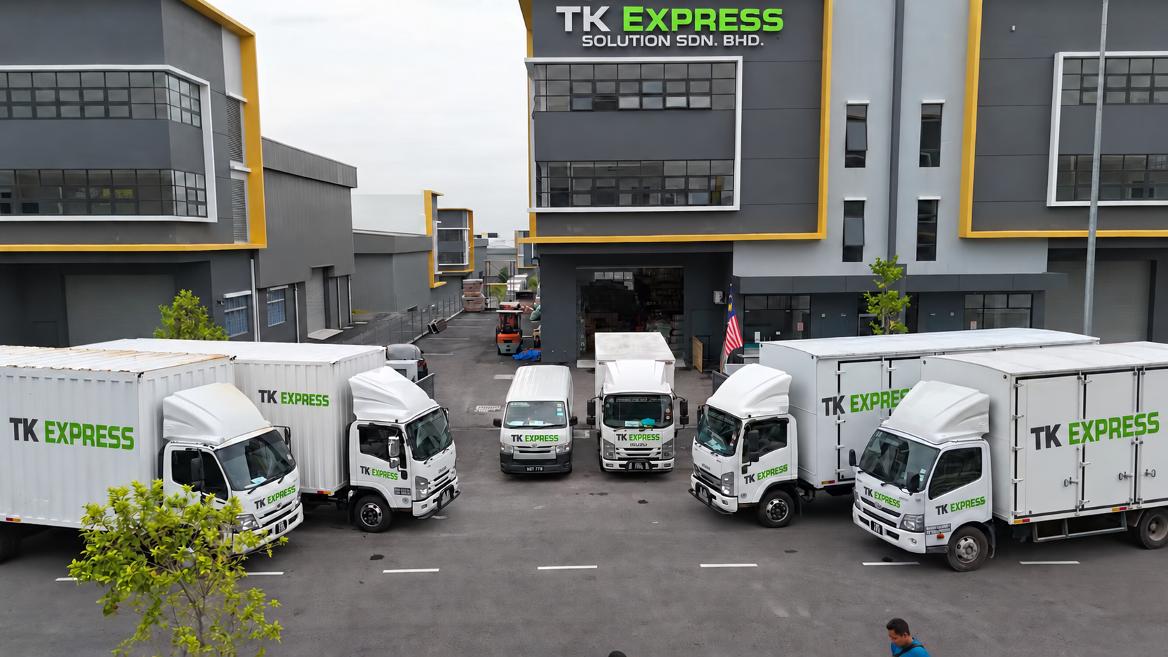 TK Express Solution warehouse and branded delivery truck fleet